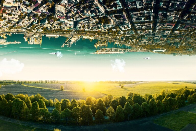 Natural landscape with unreal upside down sityscape.